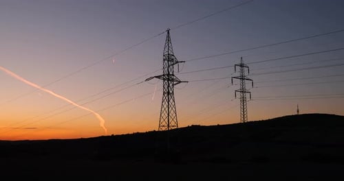 Columns High Voltage High Power Sunlight in the Moravia Tuscany region. Colorful sky in backgroud.