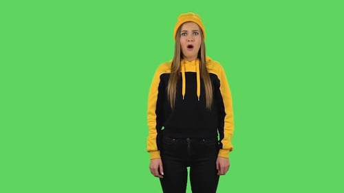Modern Frustrated Girl in Yellow Hat with Shocked Wow Face Expression. Green Screen