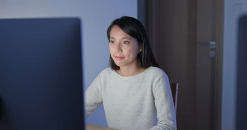 Woman work on computer at night