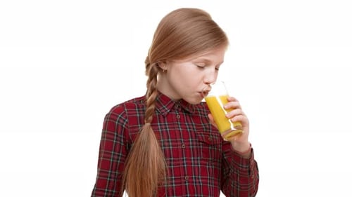 Girl Enjoying a Glass of Refreshing Juice