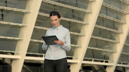 Businesswoman Holding a Clipboard