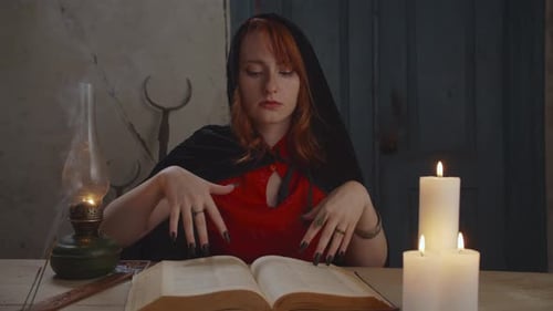 Woman Fortune Teller at Table With Tarot Cards