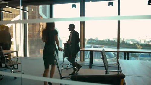 Adults Dancing in Modern Office Celebrating Success