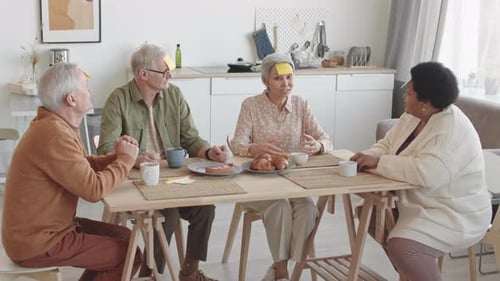 Senior Friends Playing Post-It Note