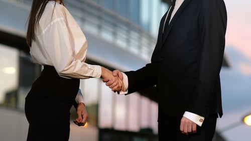 Business Handshake Outside Office Building at Daytime