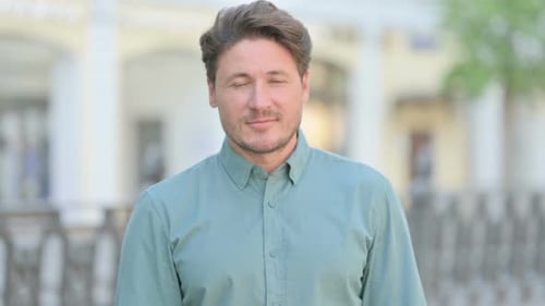 Man Looking at the Camera Outdoors