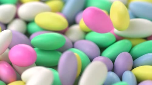 Colorful Sugared Almonds Falling in Slow Motion