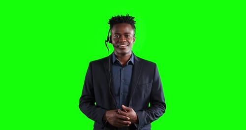 Animation of an African American man in suit using an earpiece and talking in a green background