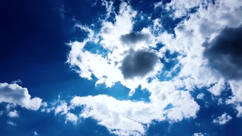 Building motions clouds. Puffy fluffy white clouds sky time lapse. slowing clouds. B Roll Footage Cl