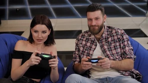 Couple Playing Video Games at Home Together