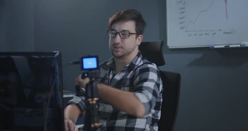 Man Recording a Vlog in Office