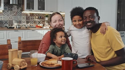 Happy Family Poses in a Bright Kitchen