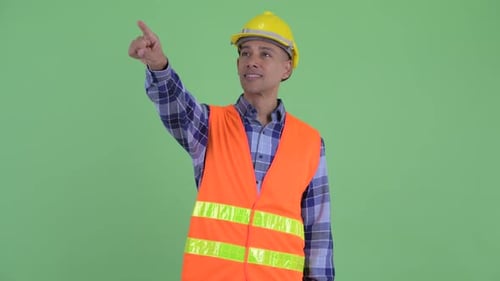 Happy Multi Ethnic Man Construction Worker Pointing Finger