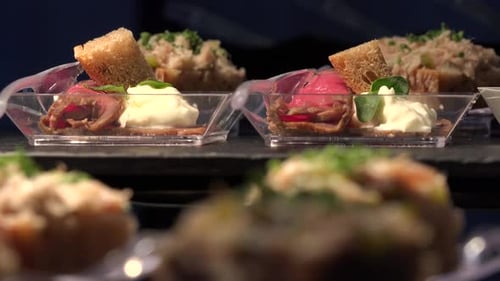 Various Restaurant Meals on Tables - Closeup