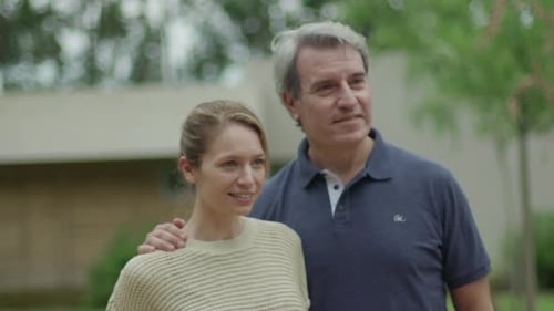 Couple Walking Together Outdoors on a Sunny Day