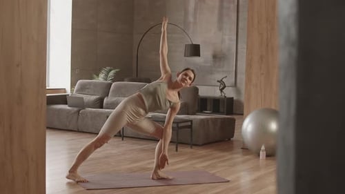 Caucasian Woman Practicing Yoga at Home