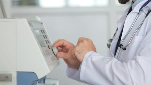 Medical Professional Operating Healthcare Equipment in Hospital