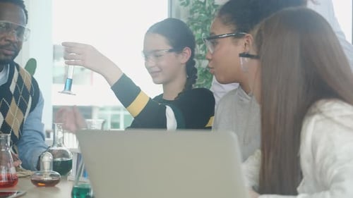 Children Learn Science in School Laboratory with Teacher
