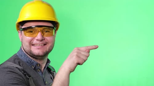 Man in Hardhat Pointing on Green Screen