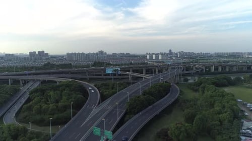 Aerial Drone View of Highway Multilevel Junction Road with Moving Cars at Sunset
