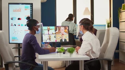 Team Having Virtual Meeting in Modern Office