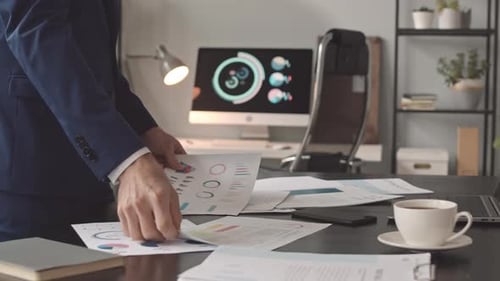 Business Professional Analyzing Financial Data in Office