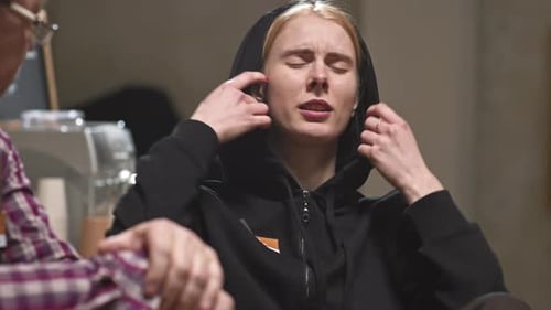 Upset Young Adult Talking Indoors