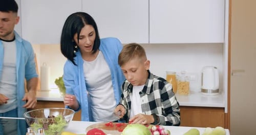 Family Prepares a Healthy Meal in a Modern Kitchen
