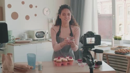 Woman Recording Baking Video in Bright Kitchen