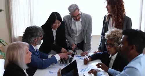 Multiracial business people working inside bank office