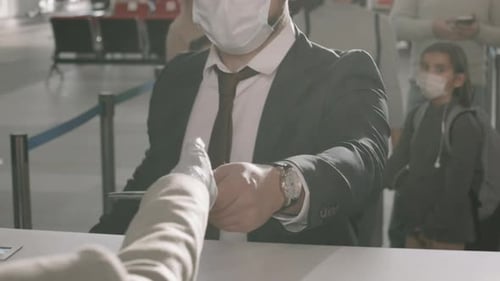 Traveler Presents Document at Airport Service Counter