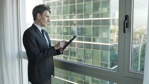 Businessman using digital tablet in office