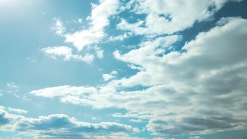 Cloudy Sky With Fluffy Clouds