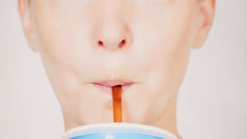 Close Up Face Young Woman Drinking