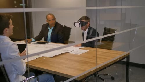Men Meeting Using Virtual Reality in Conference Room