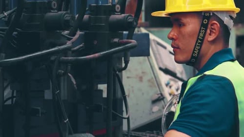 Smart Factory Worker Using Machine in Factory Workshop