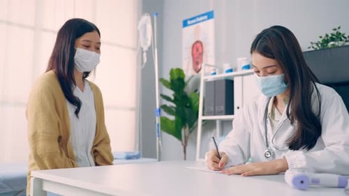 Doctor Consults Patient in Bright Medical Office