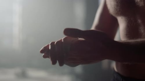 Shirtless Athlete Clapping Hands at the Gym