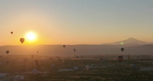 Aerial Cinematic Drone View of Colorful Hot Air Balloon Flying Over Cappadocia