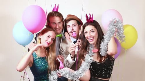 Funny crazy friends in photo booth