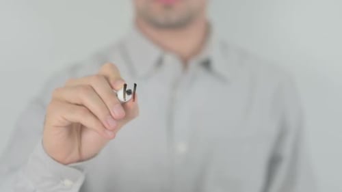Man Writes Handmade on Clear Surface with Marker