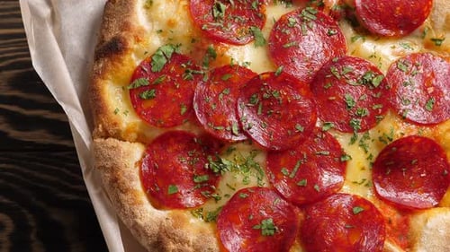 Close Up Pepperoni Pizza on Parchment Paper