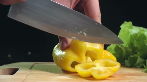 Yellow Bell Pepper Sliced on Cutting Board