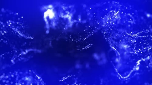 Blue ink in high speed camera water photography. gold glitter background with sparkling glitter