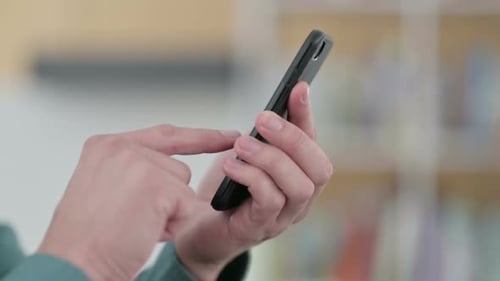 Close Up of Hands of Man Using Smartphone