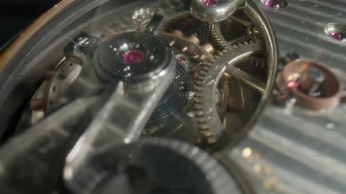 Intricate Clock Gears in Precise Mechanical Motion