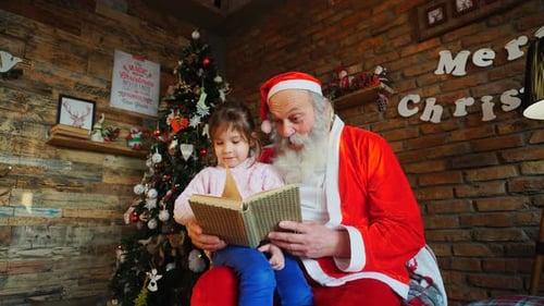 Santa Claus Reading a Book With a Child