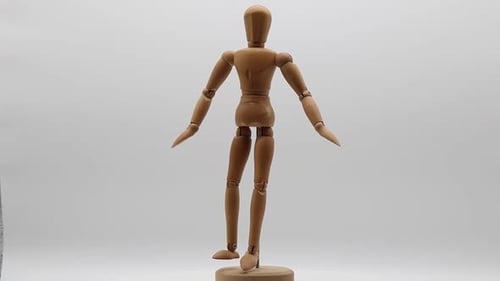 Rotating Wooden Mannequin on White Background