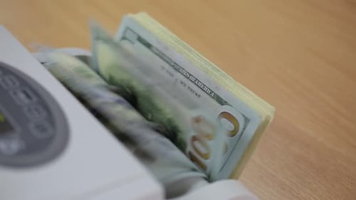 Automated Machine Counts Large Stack of Dollar Bills