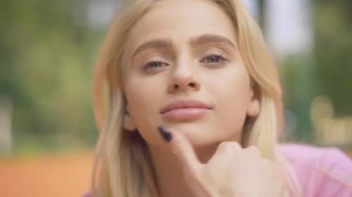 Close-up Face of Blond Young Woman with Grey Eyes Smiling at Camera. Portrait of Charming Beautiful